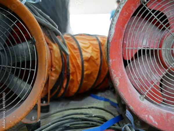 Obraz closeup of exhaust fan or portable ventilation fan at construction site.