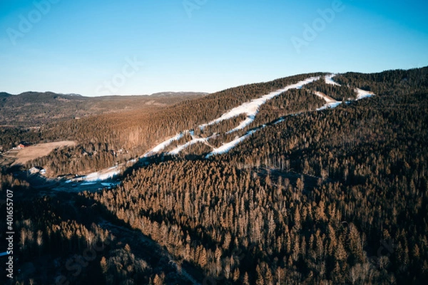 Fototapeta Drone photo shot from the sky. Countryside just outside of Oslo, Norway. Fields and wood mixed together. 