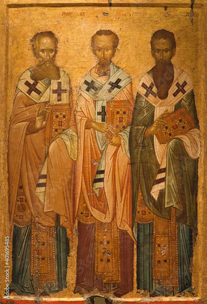 Obraz Ancient icon of the Three Hierarchs, church fathers - Basil the Great,  Gregory the Theologian and John Chrysostom. Thessaloniki, Greece, 14th cent.