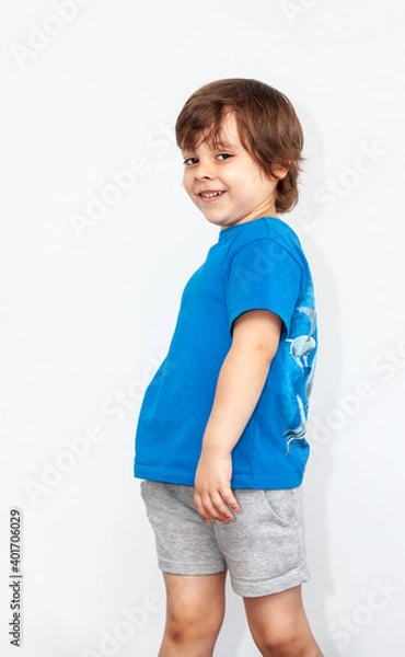 Obraz portrait of an emotional boy on a light background