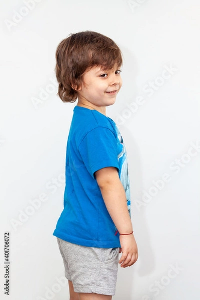 Obraz portrait of an emotional boy on a light background