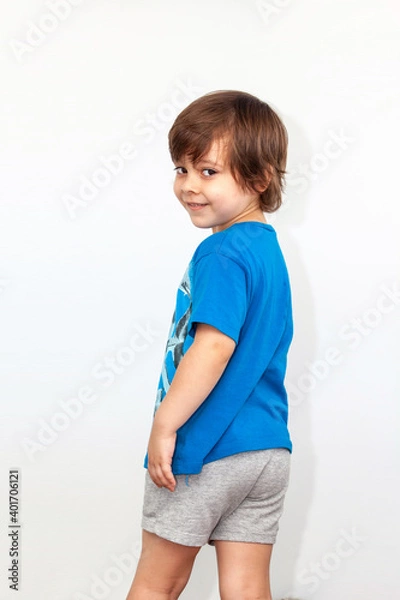 Obraz portrait of an emotional boy on a light background