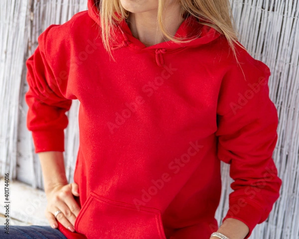 Obraz Unrecognizable blon woman wears red hoodie. Casual christmas outfit. Clothing design with copy space for mockup.