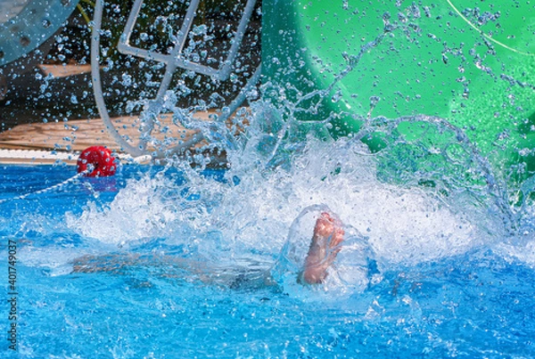 Fototapeta The man fell into the pool. Lots of splashes.