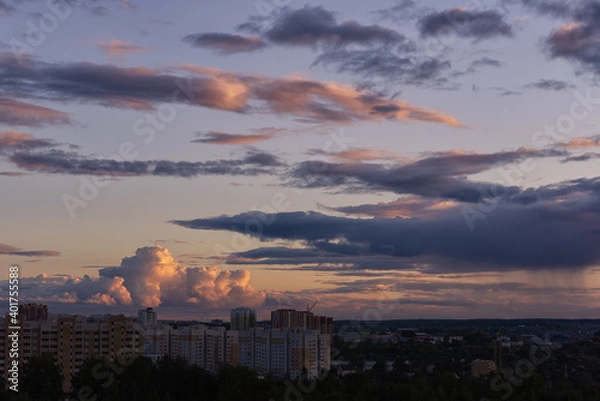 Fototapeta Deep blue rainy clouds and  some rays of light