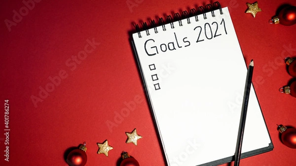 Obraz notebook with goal list 2021 red background Vorsätze