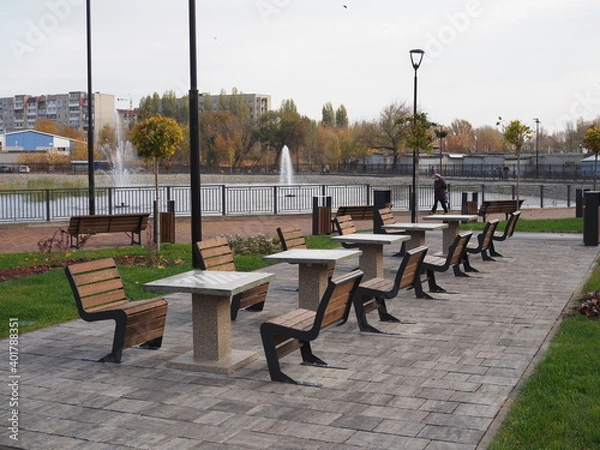 Obraz Concrete chess table for outdoor play. Chess playground in the city park. Contemporary concrete architecture and public space decoration