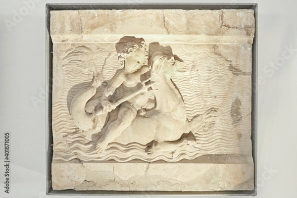Fototapeta Nice little reliefs with putti and sea monsters.