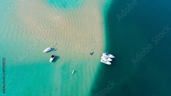 Obraz Aerial view of boats anchored on a sand bar in crystal clear blue water.