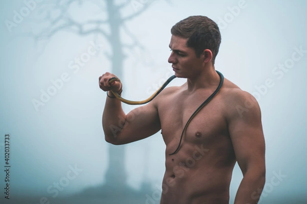 Fototapeta man with snake