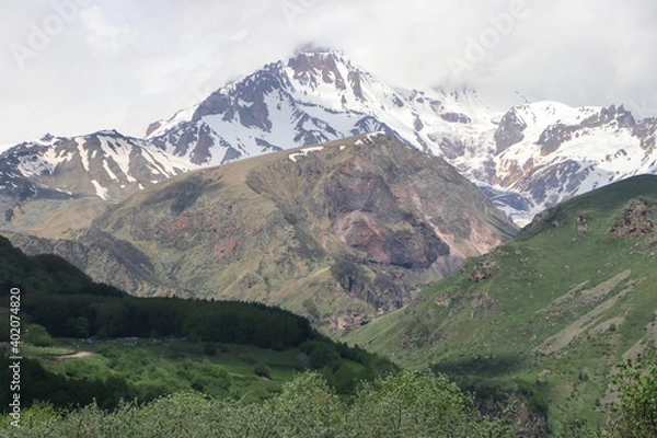 Fototapeta View of the snow-capped peak of Mount Kazbek in Georgia.