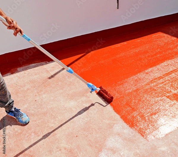 Obraz Waterproofing the house terrace with red rubber waterproof coating paint. 