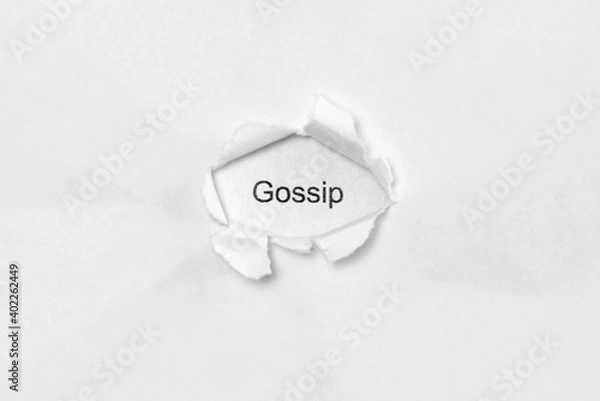 Fototapeta Word gossip on white isolated background, the inscription through the wound hole in paper. Concept of gender identity and sexual minorities. Stock photo for web and print with empty space for text