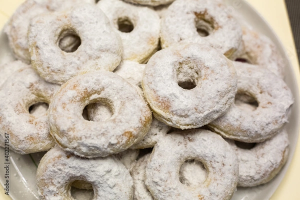 Obraz Homemade powdered sugar donuts. Background texture