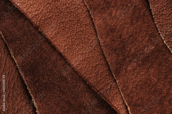 Fototapeta A sample of the texture of natural leather and brown suede. Close-up.
