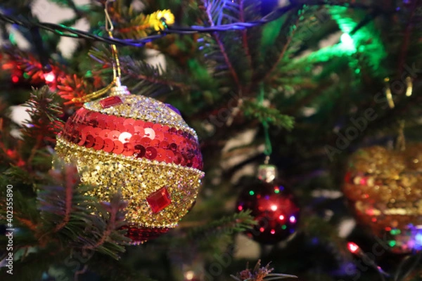 Fototapeta Christmas tree with new year decorations. New Year celebration. Selective soft focus. Background for postcards