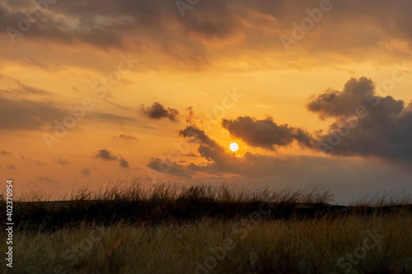 Obraz clouds with landscape during sunset