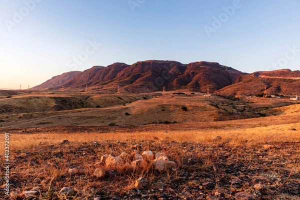 Obraz landscape during sunset  against blue sky