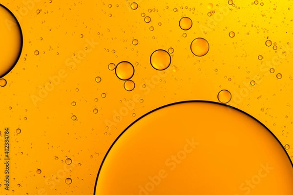 Fototapeta Golden bubbles. Yellow circles. Abstract background. Bubble oil on water. Macro-photography.