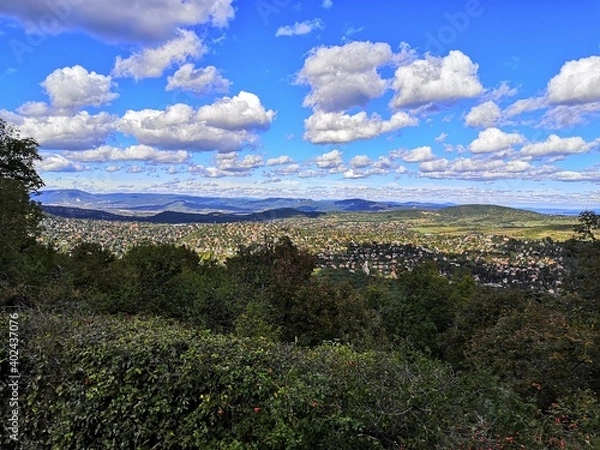 Obraz landscape with sky, clouds and city