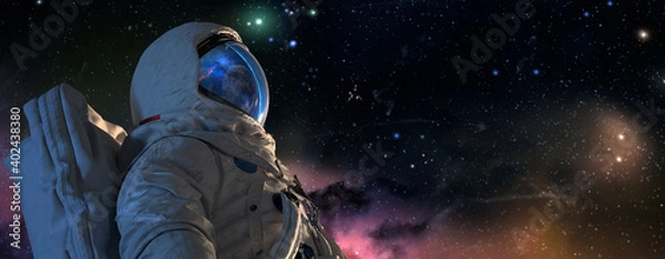 Fototapeta An astrounaut spaceman in outer space closeup shot