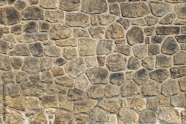 Fototapeta Stone wall with tightly fitted stones and abstract mosaic back ground pattern