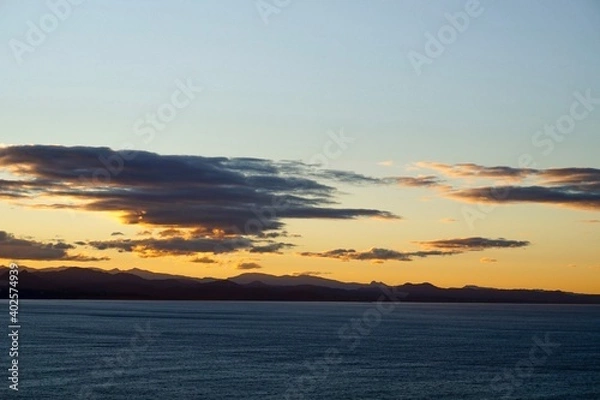 Fototapeta The view from Cape Byron out towards the Hinterlands as the sun sets - Byron Bay