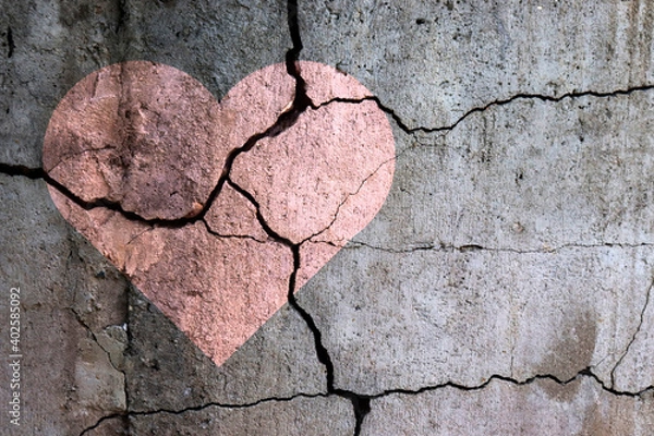 Obraz A broken heart. Drawing of a heart on a cracked wall. Broken relationships. Treason and betrayal. Past love. A quarrel.