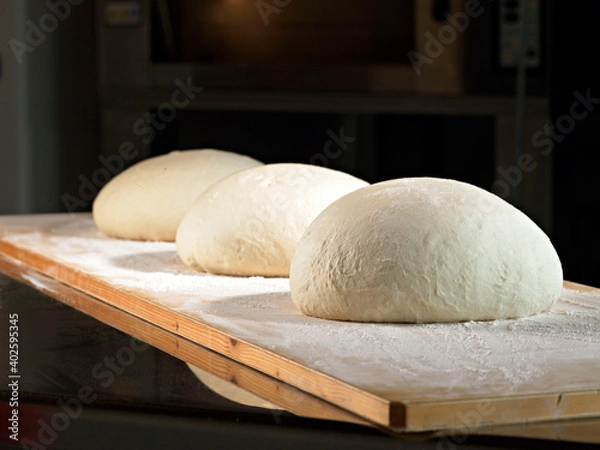 Obraz leavening bread dough on a wooden surface