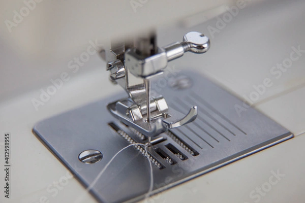 Obraz details of the sewing machine. working at home at a sewing machine.

