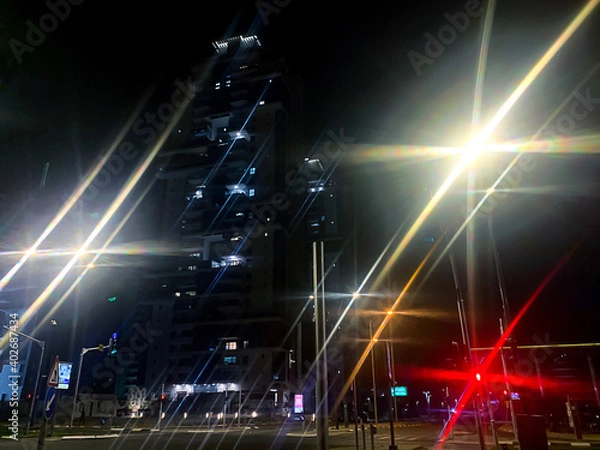 Fototapeta Night city with colorful illumination. Abstraction