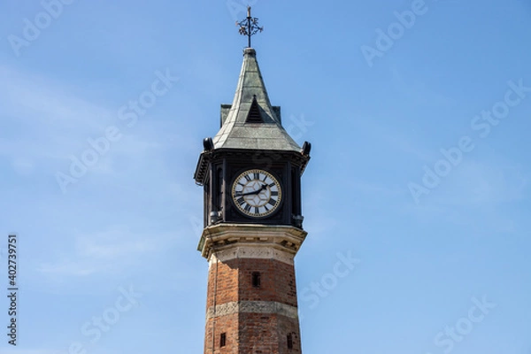 Fototapeta The British seaside town of Skegness in the East Lindsey a district of Lincolnshire, England, showing the an old towner on a roundabout