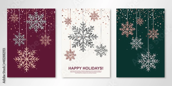 Fototapeta Happy Holidays banners set with rose gold and silver hanging snowflakes. Vector winter design templates for invitations, greeting cards. All isolated and layered