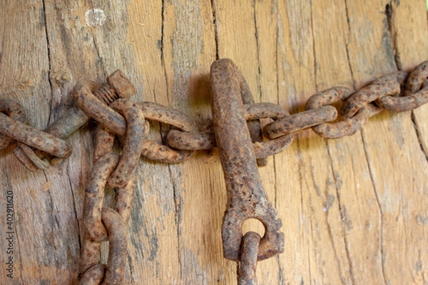 Fototapeta Old, rusted, corroded chain used on a farm