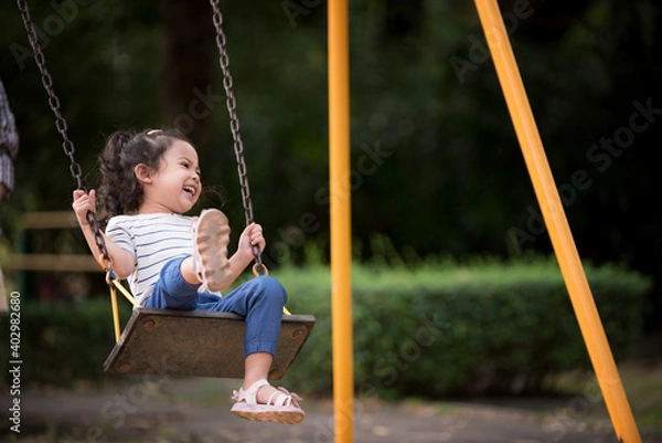 Fototapeta Little children having fun in the playground