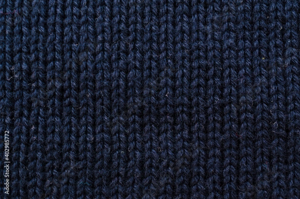 Fototapeta Wool hand knit pattern. Colored wool knitting texture background. Knitted wool sweater