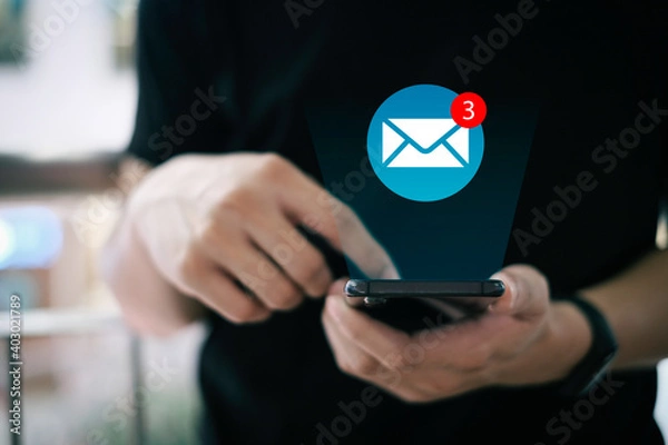 Fototapeta Beautiful hand working on a smartphone with email icons, Concept of sending message wireless using smartphone, copy space for design.