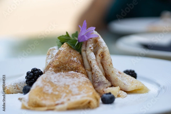 Obraz Pancakes with blueberries and sugar...