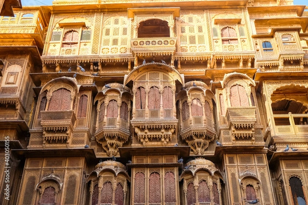 Fototapeta Beautiful details carved facade wall and windows exterior architecture in Patwon Ki Haveli in Jaisalmer, rajasthan India. This is Famous Haveli Architecture in Rajasthan.