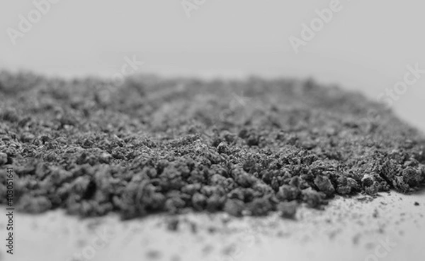 Obraz Cigarette ash scattered on white background