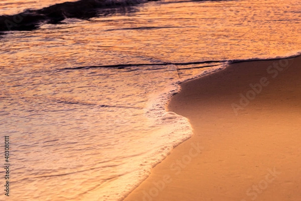 Fototapeta Nature in twilight period which including of sunrise over the sea and the nice beach. Summer beach with blue water and purple sky at the sunset.