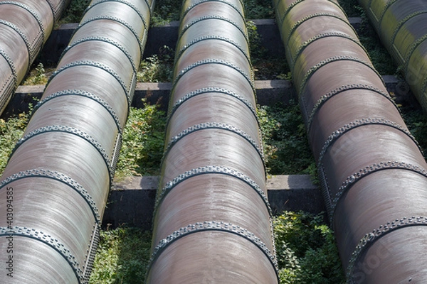 Fototapeta Close up of water pipes of a hydroelectric power plant (Walchenseekraftwerk). Finally the electricity is generated by huge turbines.