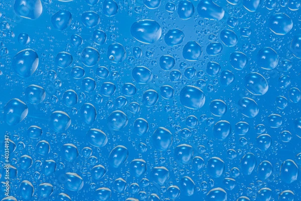 Obraz Close up water drops on blue background