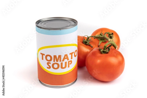 Fototapeta A generic labeled can of tomato soup with a bunch of ripe red tomatoes on the vine isolated on white