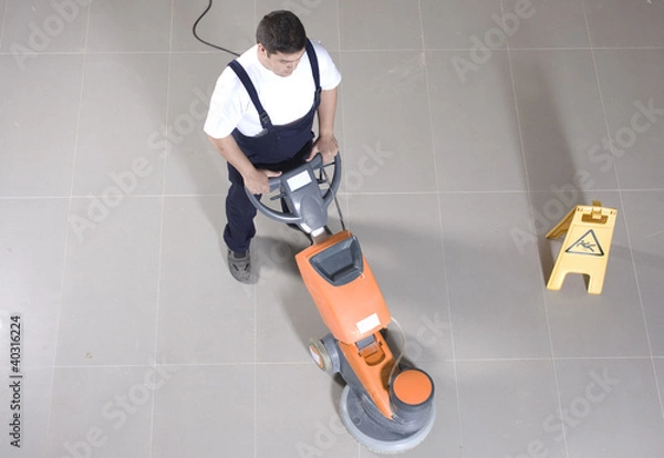 Obraz cleaning floor with machine