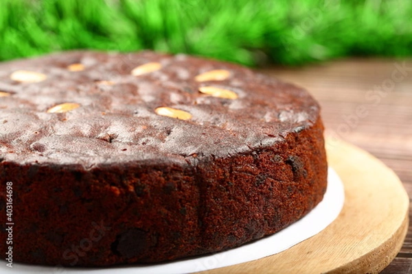 Fototapeta Top view- homemade rich plum cake on a holiday background.