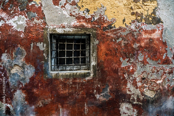 Obraz old house facade with window and grille