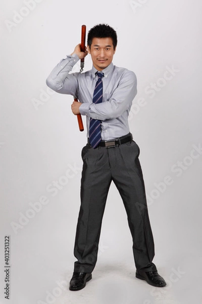 Fototapeta A business man with a double stick