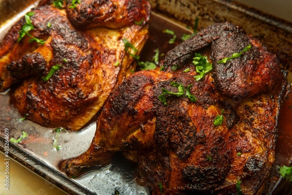 Fototapeta Cooking Peruvian Halved Chicken