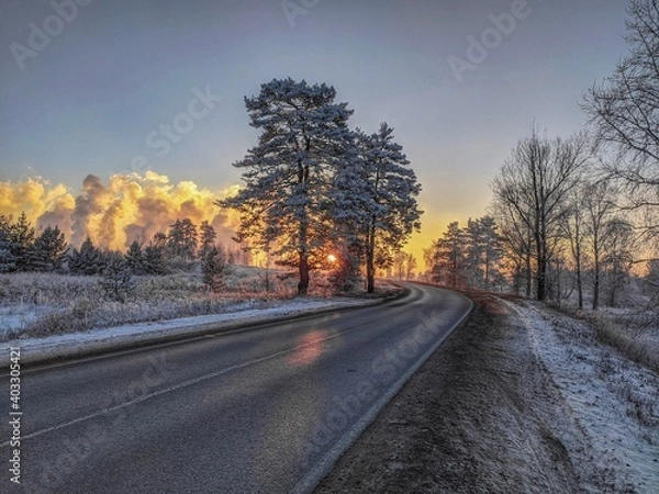 Fototapeta A beautiful sunset against the backdrop of an ecological disaster...